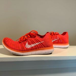 Nike Free Run shoes size 8; bright coral; like new